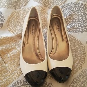 Cream and black pumps